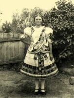 185. Young girl dressed in Sunday clothes in summertime